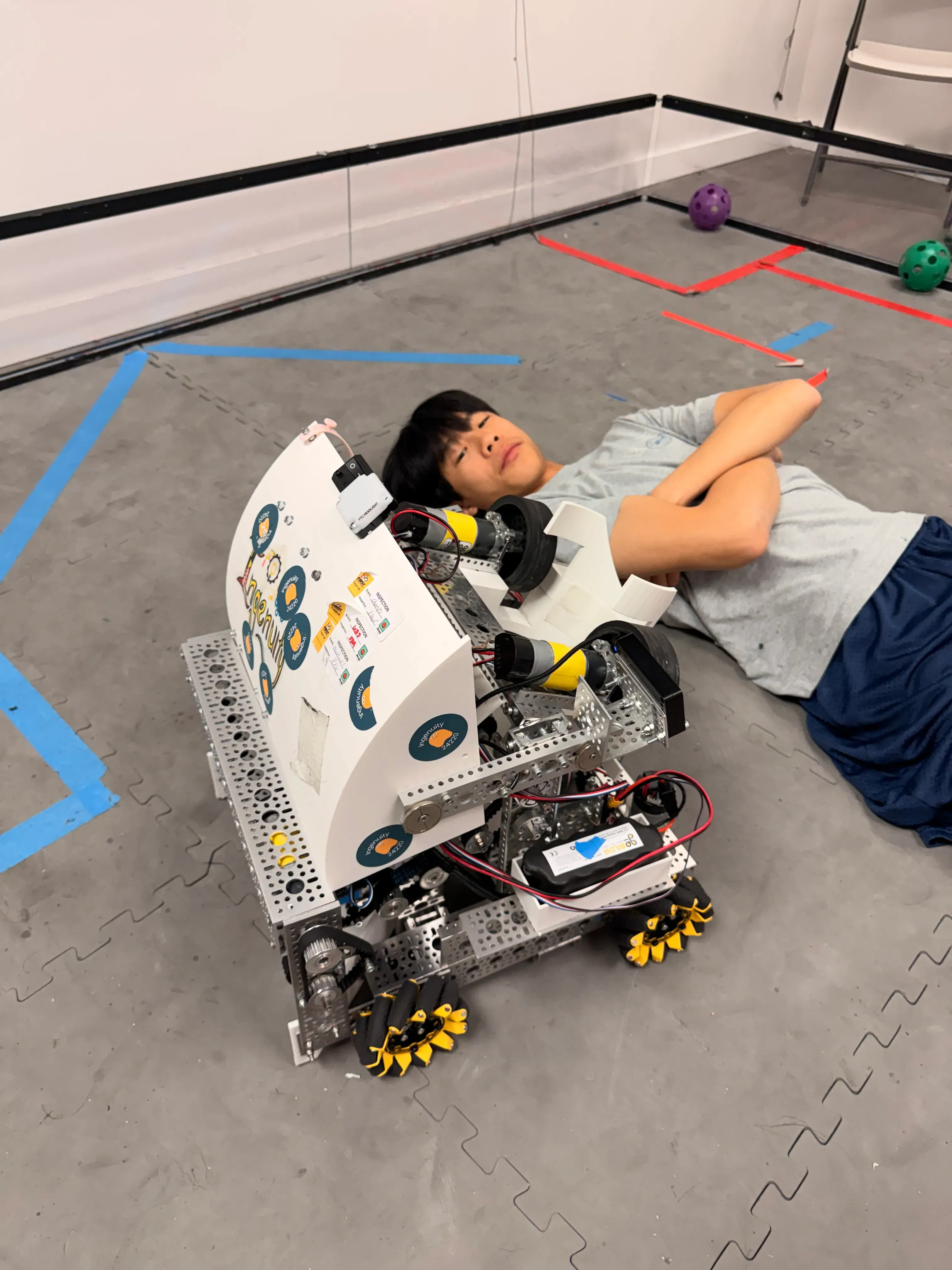 Our 2025-2026 robot, Ginny, next to Erik